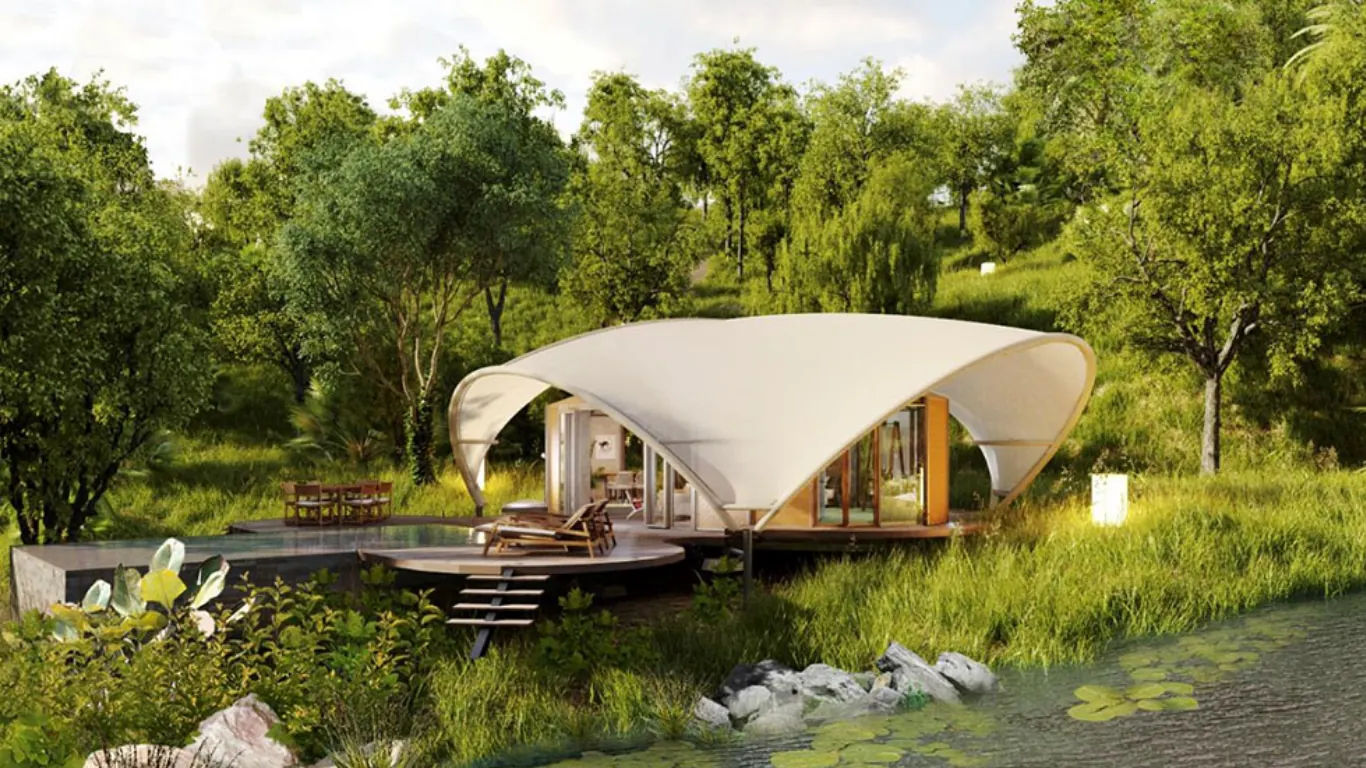 Sculptural white canopy pavilion in lush greenery beside a lily pond